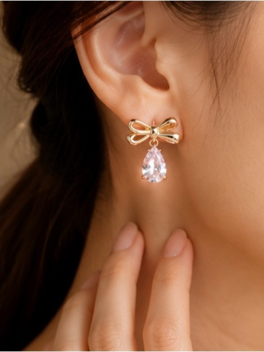 Elegant Gold Bow Earrings with Pale Pink Teardrop Crystals
